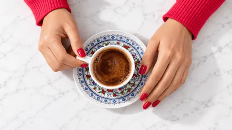 Turkish coffee in a patterned cup, ready for a coffee cup reading Turkish coffee in a patterned cup, ready for a coffee cup reading